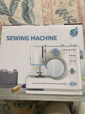 Compact White and Light Blue Sewing Machine -